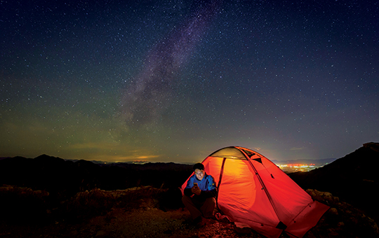 Image of man near tent